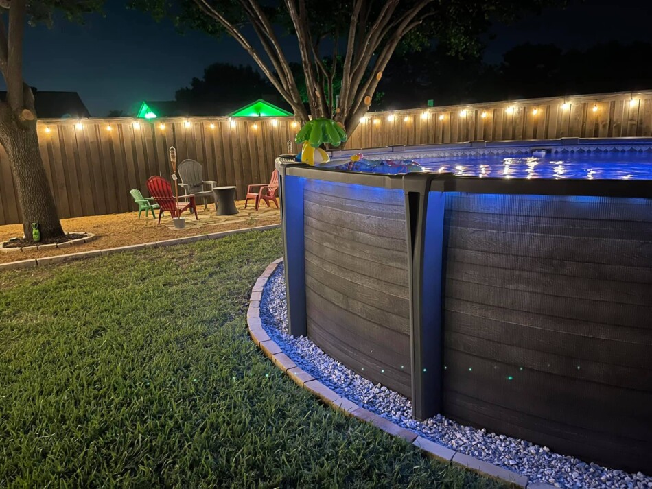 Modern above ground pool with landscaping looking attractive at night

